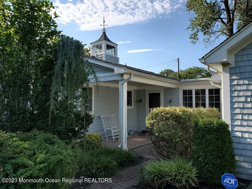 218 Bridge Avenue Point Pleasant Beach, NJ 08742 - Photo 2 of 19 a front view of a house with garden