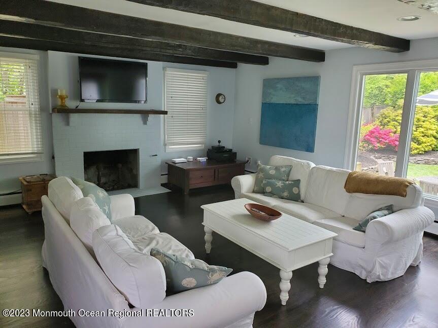218 Bridge Avenue Point Pleasant Beach, NJ 08742 - Photo 9 of 19 a living room with furniture and a fireplace