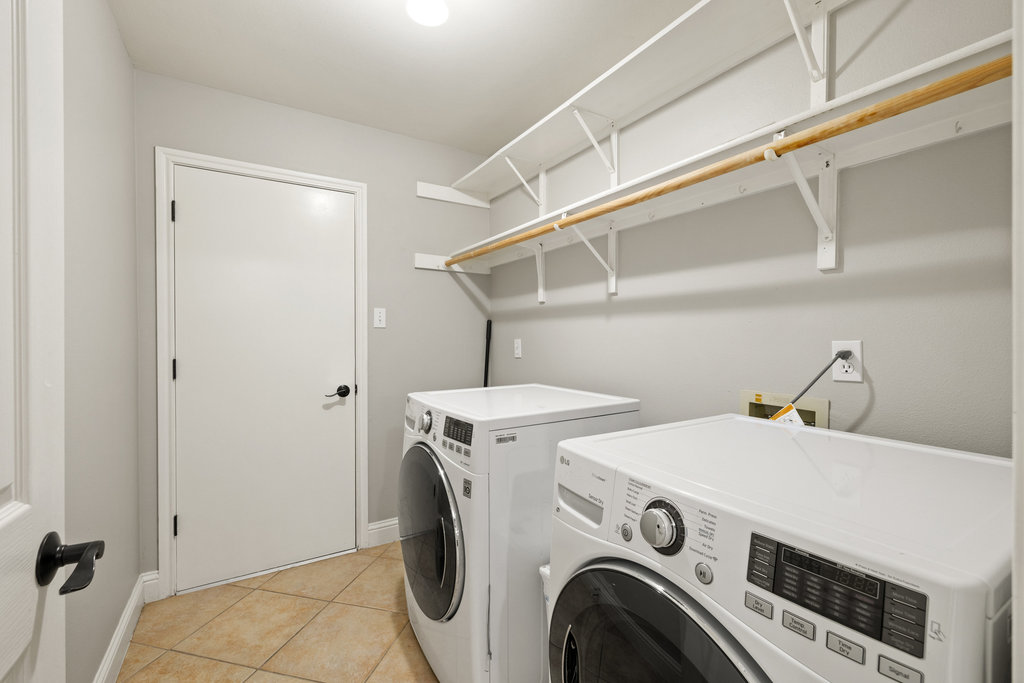 604 Cutty Trail Lakeway, TX 78734 - Photo 27 of 40 a utility room with dryer and washer