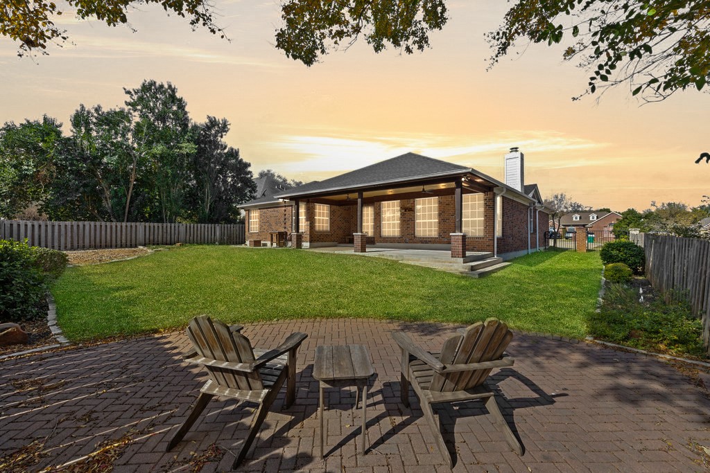 604 Cutty Trail Lakeway, TX 78734 - Photo 4 of 40 a view of a house with backyard and sitting area