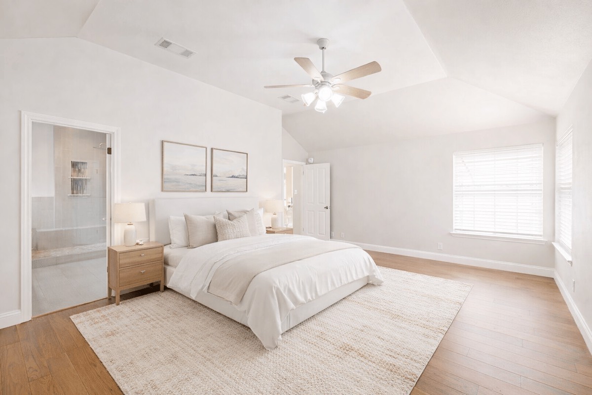 604 Cutty Trail Lakeway, TX 78734 - Photo 7 of 40 a bedroom with a large bed and a chandelier