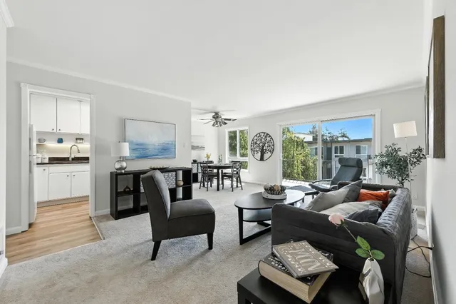 a living room with furniture and a large window