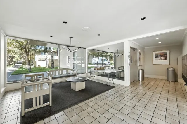 a front view of a residential apartment building with a yard