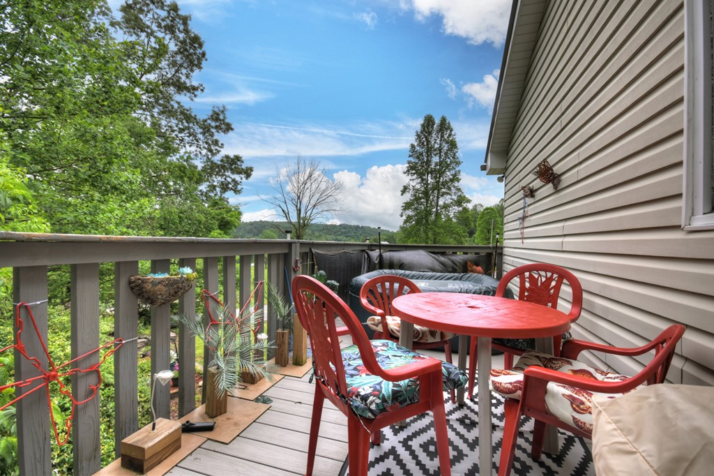 1359 Salem Road Mineral Bluff, GA 30559 - Photo 18 of 18 an outdoor sitting area with furniture and wooden floor