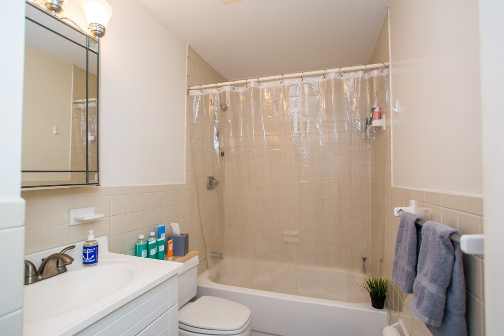 280 Commonwealth Avenue, Unit G9 Boston, MA 02116 - Photo 12 of 18 a bathroom with a sink a toilet and shower