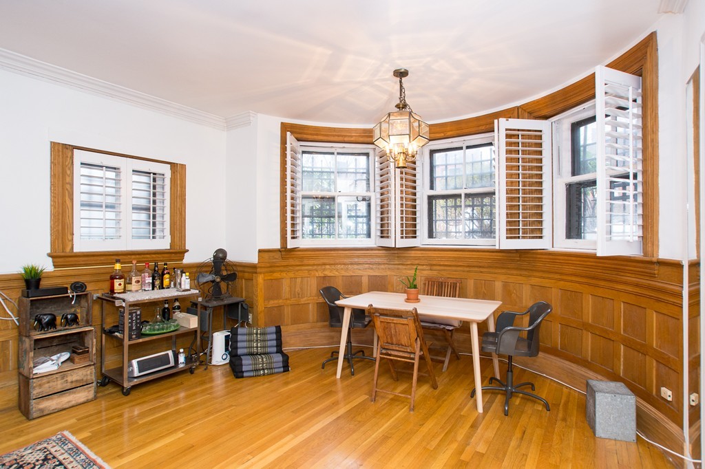 280 Commonwealth Avenue, Unit G9 Boston, MA 02116 - Photo 4 of 18 a view of a dining room with furniture a chandelier and wooden floor