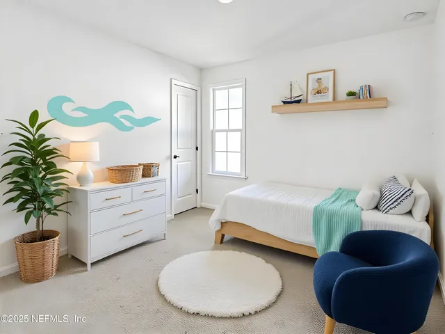 a spacious bedroom with a bed and a couch