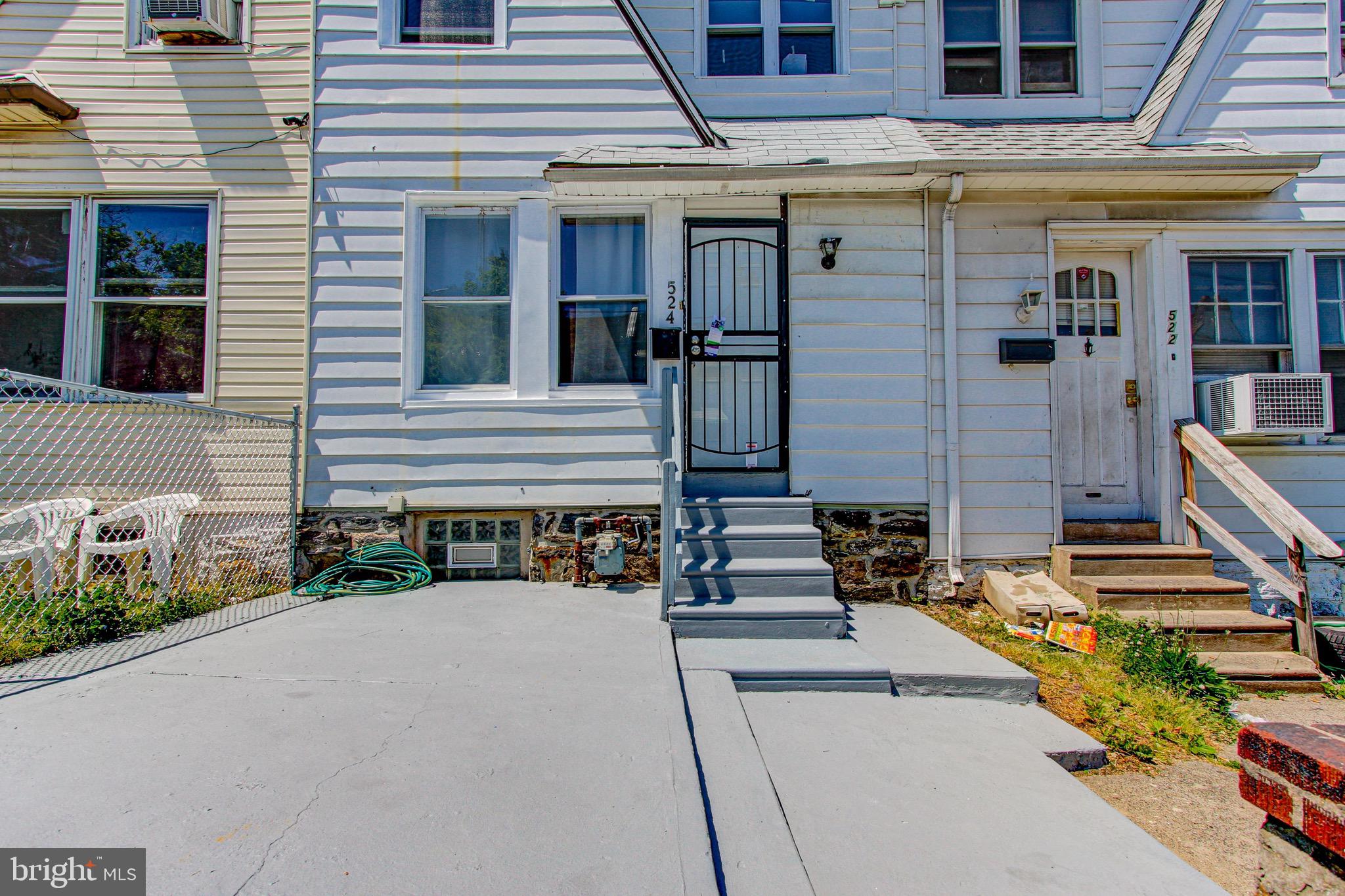 524 Glendale Road Upper Darby, PA 19082 - Photo 5 of 51 a front view of a house with a yard