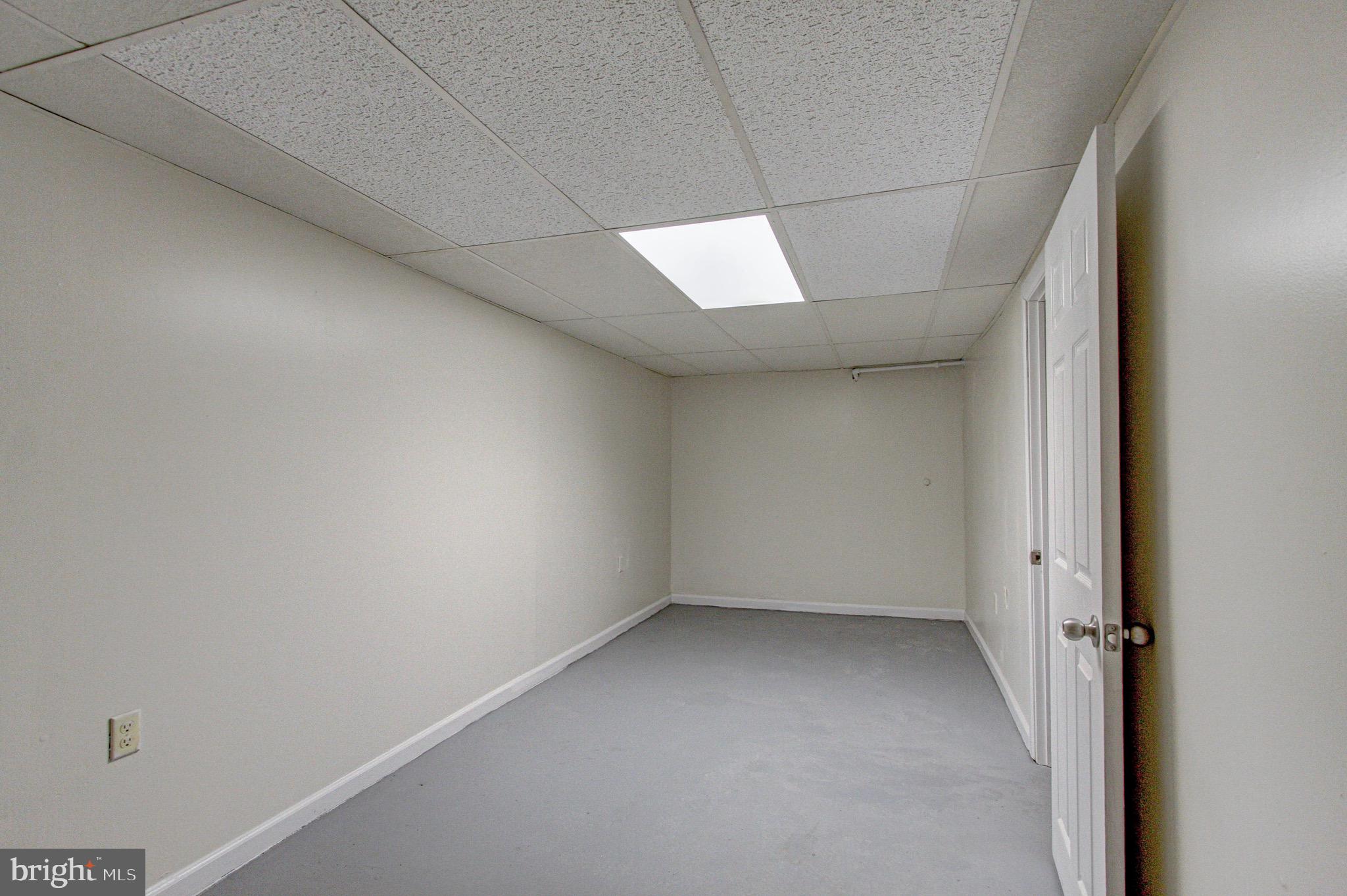 524 Glendale Road Upper Darby, PA 19082 - Photo 45 of 51 an empty room with a empty space and windows