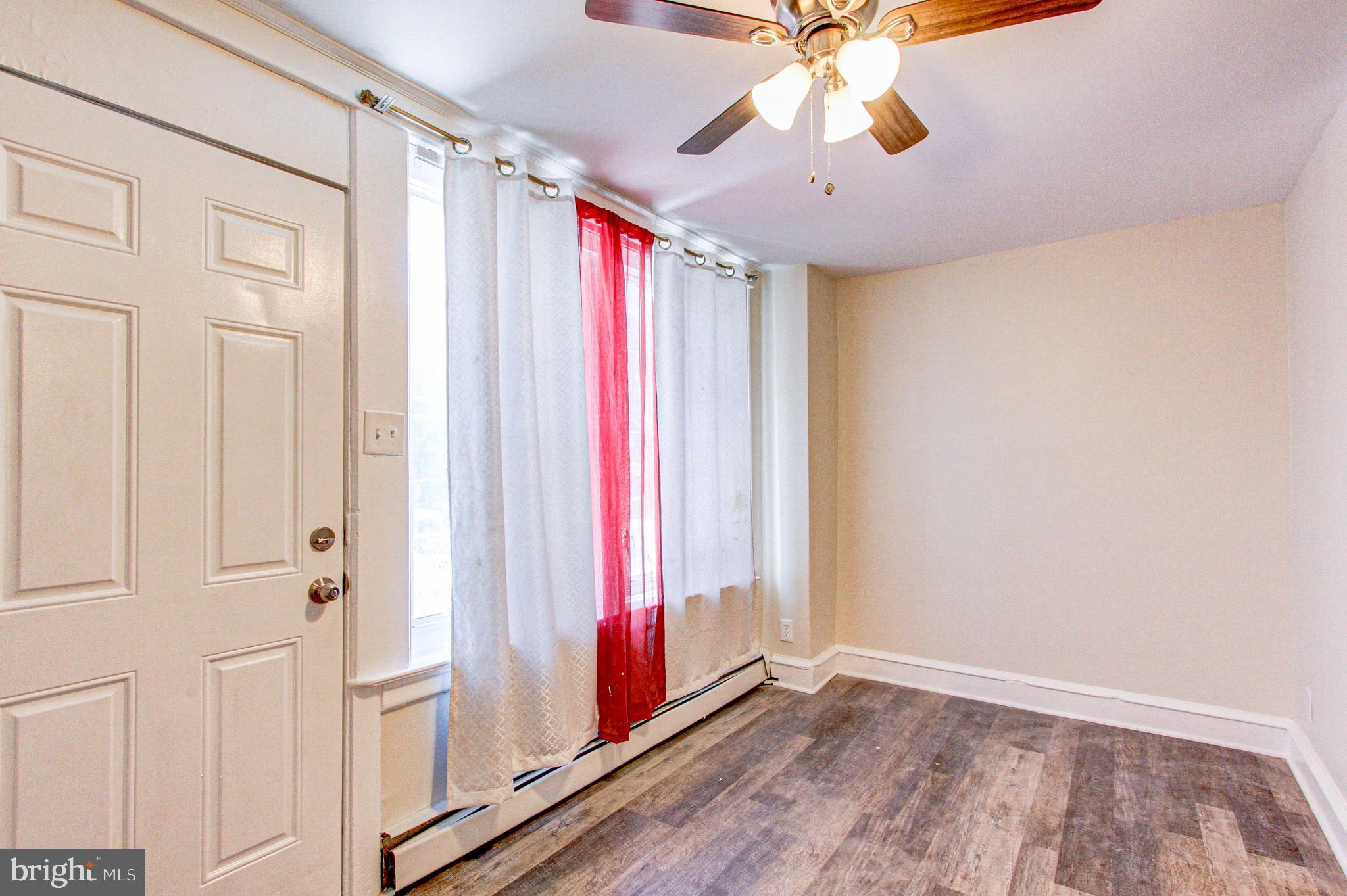 524 Glendale Road Upper Darby, PA 19082 - Photo 6 of 51 a view of a room with window and chandelier fan
