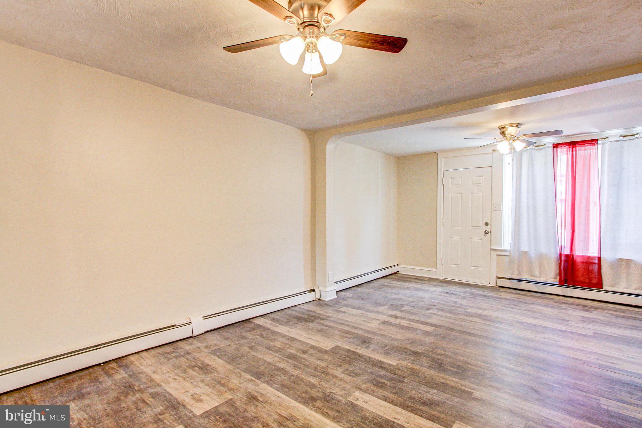 524 Glendale Road Upper Darby, PA 19082 - Photo 8 of 51 an empty room with fan and windows