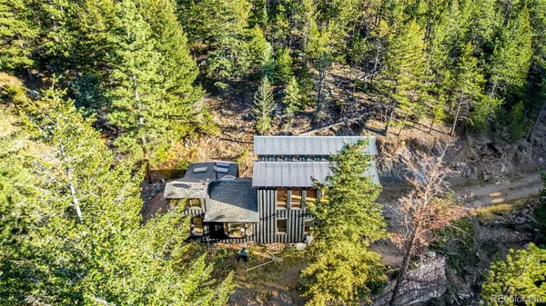 a view of a chairs and table in the patio