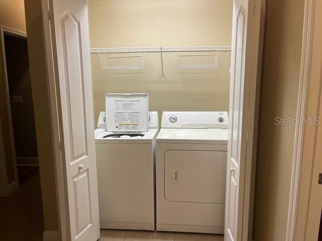 200 Riverview Bend South, Unit 911 Palm Coast, FL 32137 - Photo 19 of 23 a utility room with dryer and washer