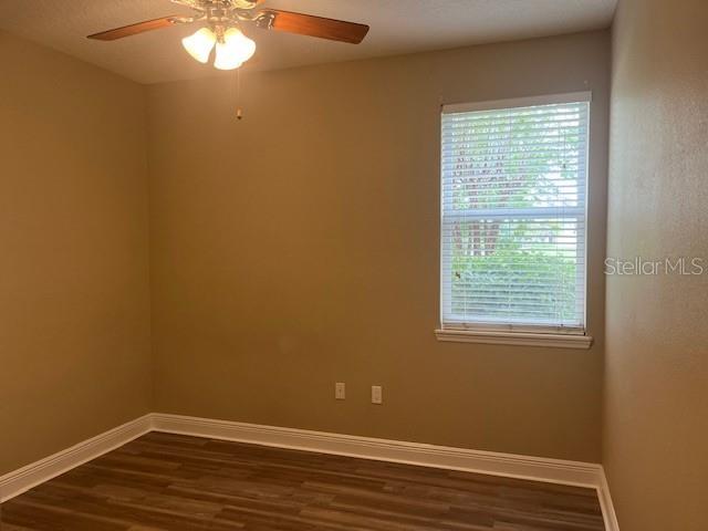 200 Riverview Bend South, Unit 911 Palm Coast, FL 32137 - Photo 10 of 23 a view of a room with wooden floor and a window