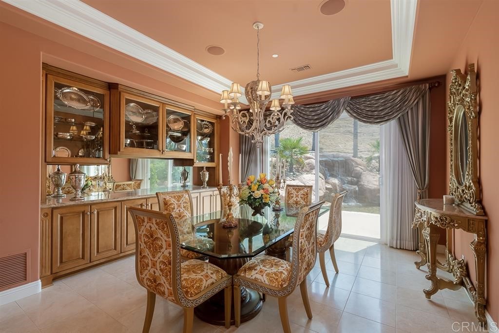 13410 Farraday Ridge Road Jamul, CA 91935 - Photo 7 of 23 a view of a dining room with furniture and chandelier