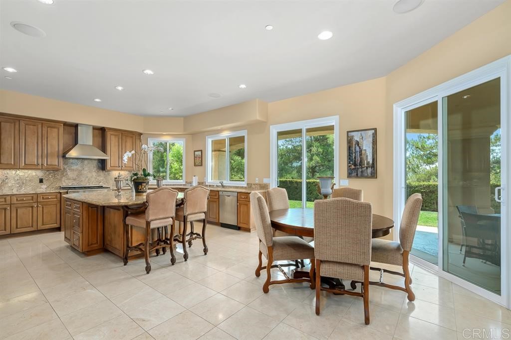 13410 Farraday Ridge Road Jamul, CA 91935 - Photo 9 of 23 a dining room with furniture a floor to ceiling window and outdoor view