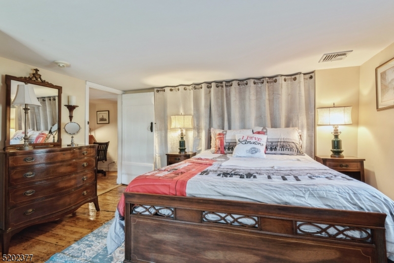 6 Hanover Road Florham Park, NJ 07932 - Photo 21 of 26 a spacious bedroom with a bed and a dresser
