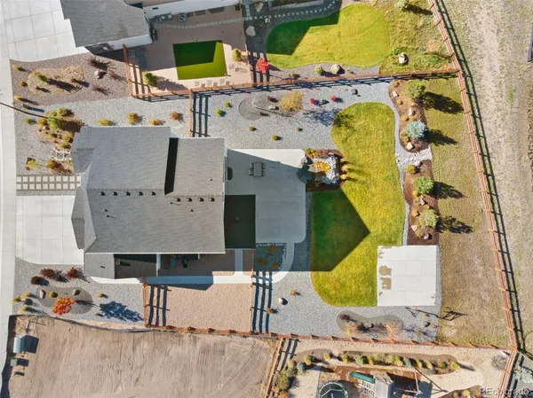 an aerial view of a house with a swimming pool