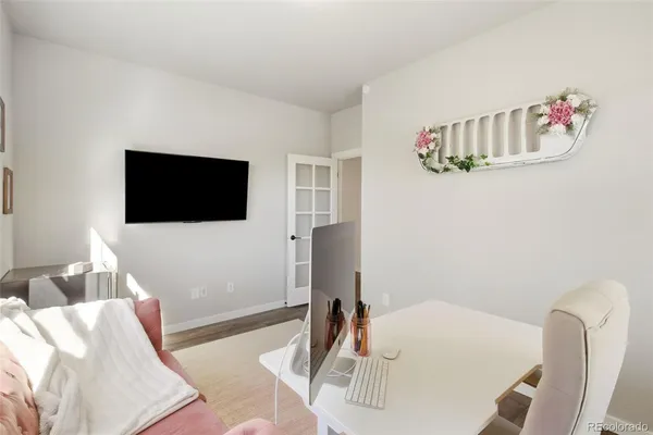 a bedroom with a bed and a television