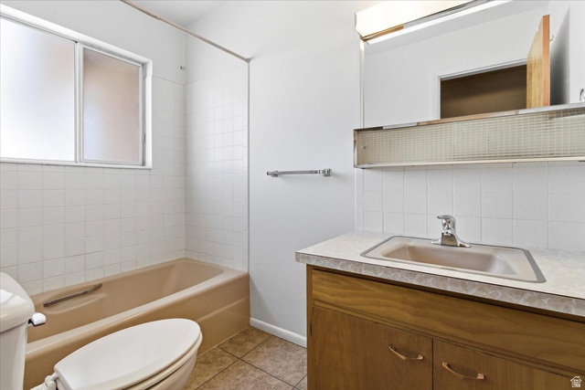 217 East 400 South Spring City, UT 84662 - Photo 27 of 71 Full bath with vanity, decorative backsplash, shower / bathtub combination, and light tile patterned flooring