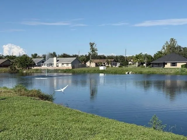 a view of outdoor space with deck and car parked