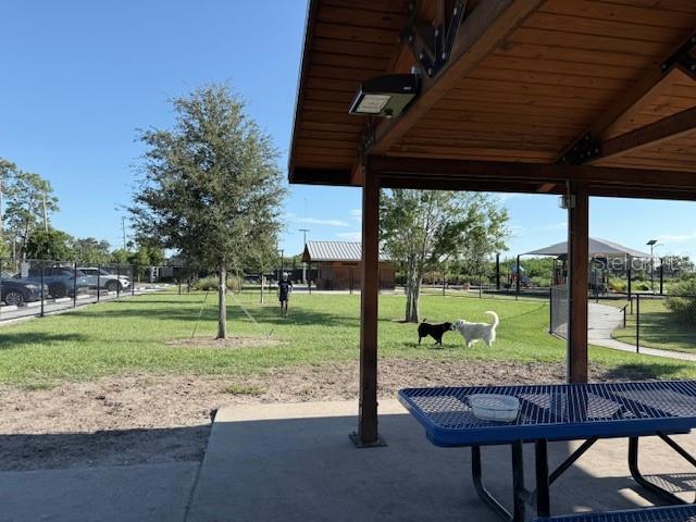 3540 65th Ave Circle East Sarasota, FL 34243 - Photo 17 of 69 a view of a porch with furniture and garden