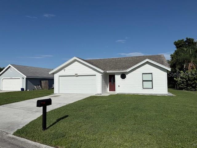3540 65th Ave Circle East Sarasota, FL 34243 - Photo 2 of 69 a house view with a garden space