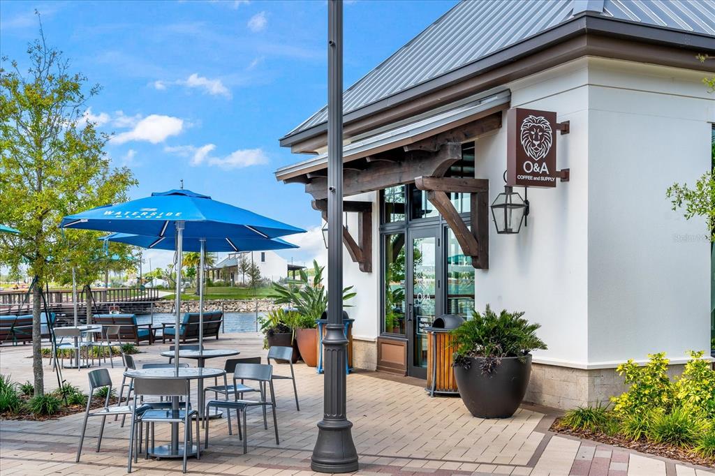 3540 65th Ave Circle East Sarasota, FL 34243 - Photo 65 of 69 a view of house with patio outdoor seating and plants