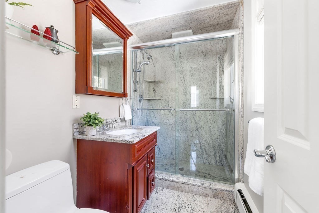 60 High Street Needham, MA 02494 - Photo 14 of 32 a bathroom with a shower toilet and sink
