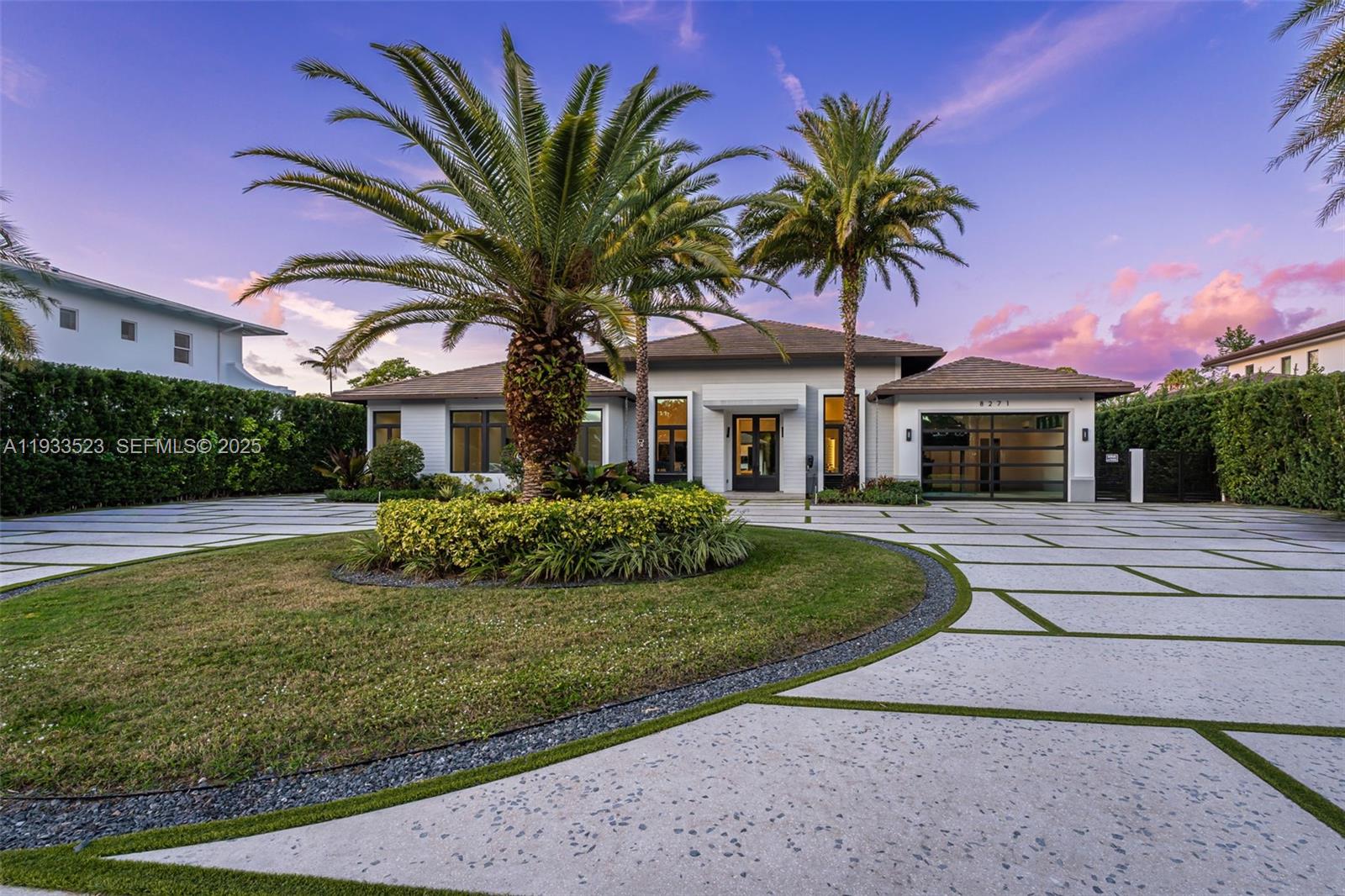 8271 Southwest 67th Street Miami, FL 33143 - Photo 23 of 88 a front view of a house with a garden and trees