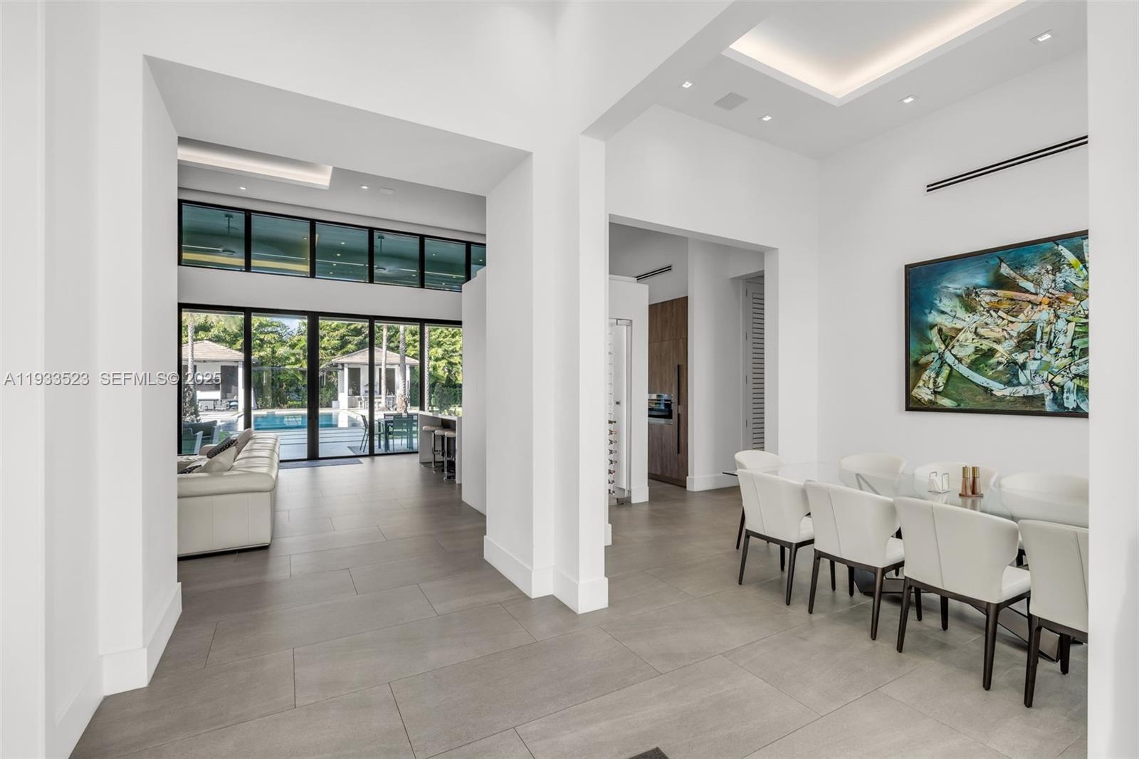 8271 Southwest 67th Street Miami, FL 33143 - Photo 25 of 88 a living room with furniture and a large window
