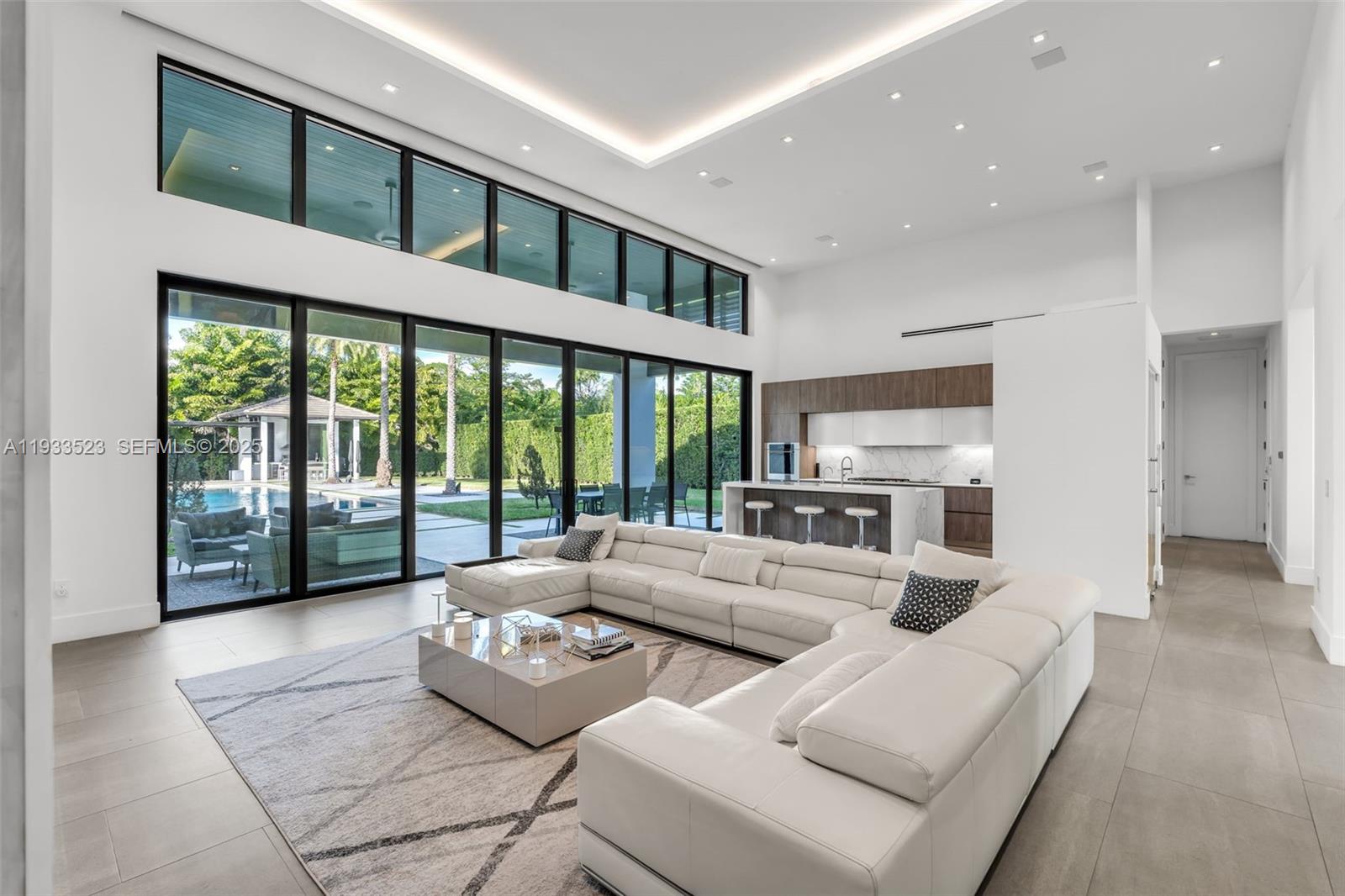 8271 Southwest 67th Street Miami, FL 33143 - Photo 28 of 88 a living room with furniture and large windows