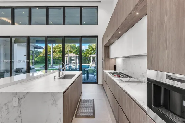 a bathroom with a double vanity sink a toilet and shower