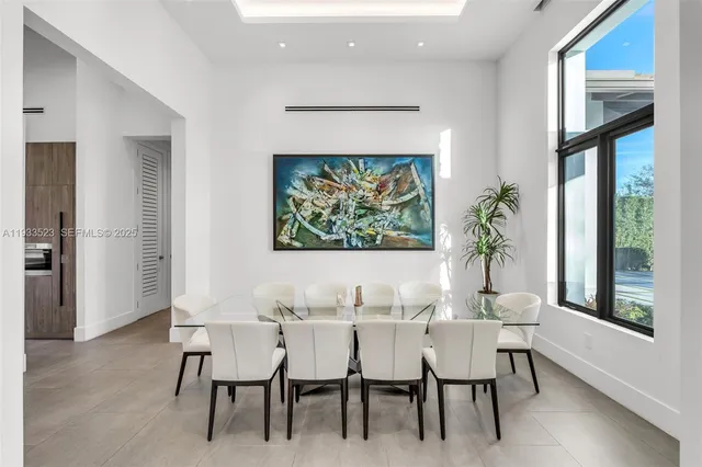 a bedroom with a bed chair and window