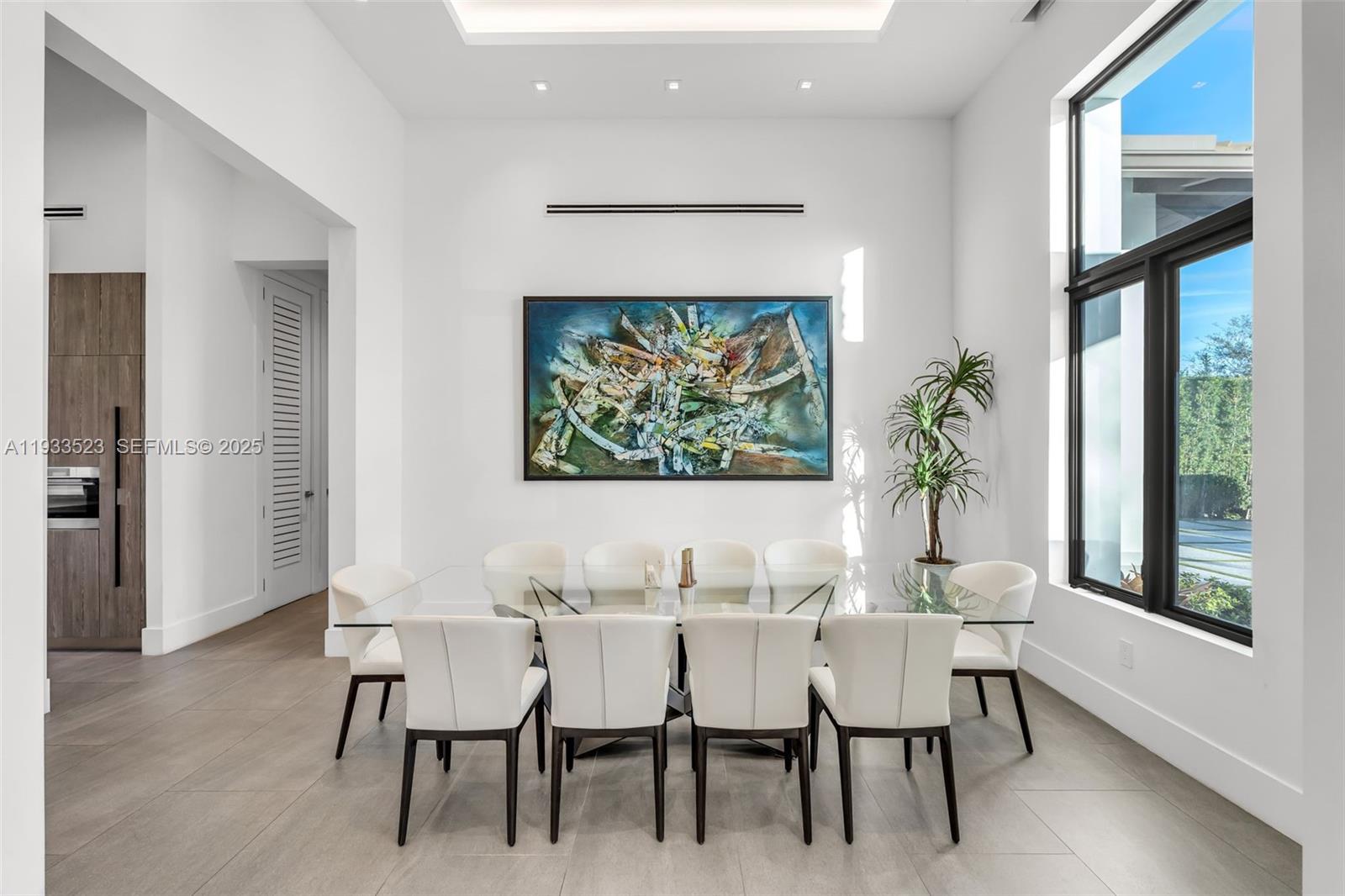 8271 Southwest 67th Street Miami, FL 33143 - Photo 40 of 88 a dining room with furniture a rug and a potted plant