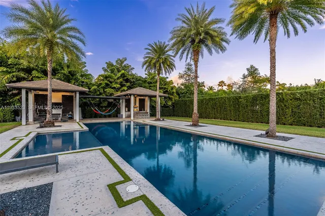 a view of a swimming pool with a patio
