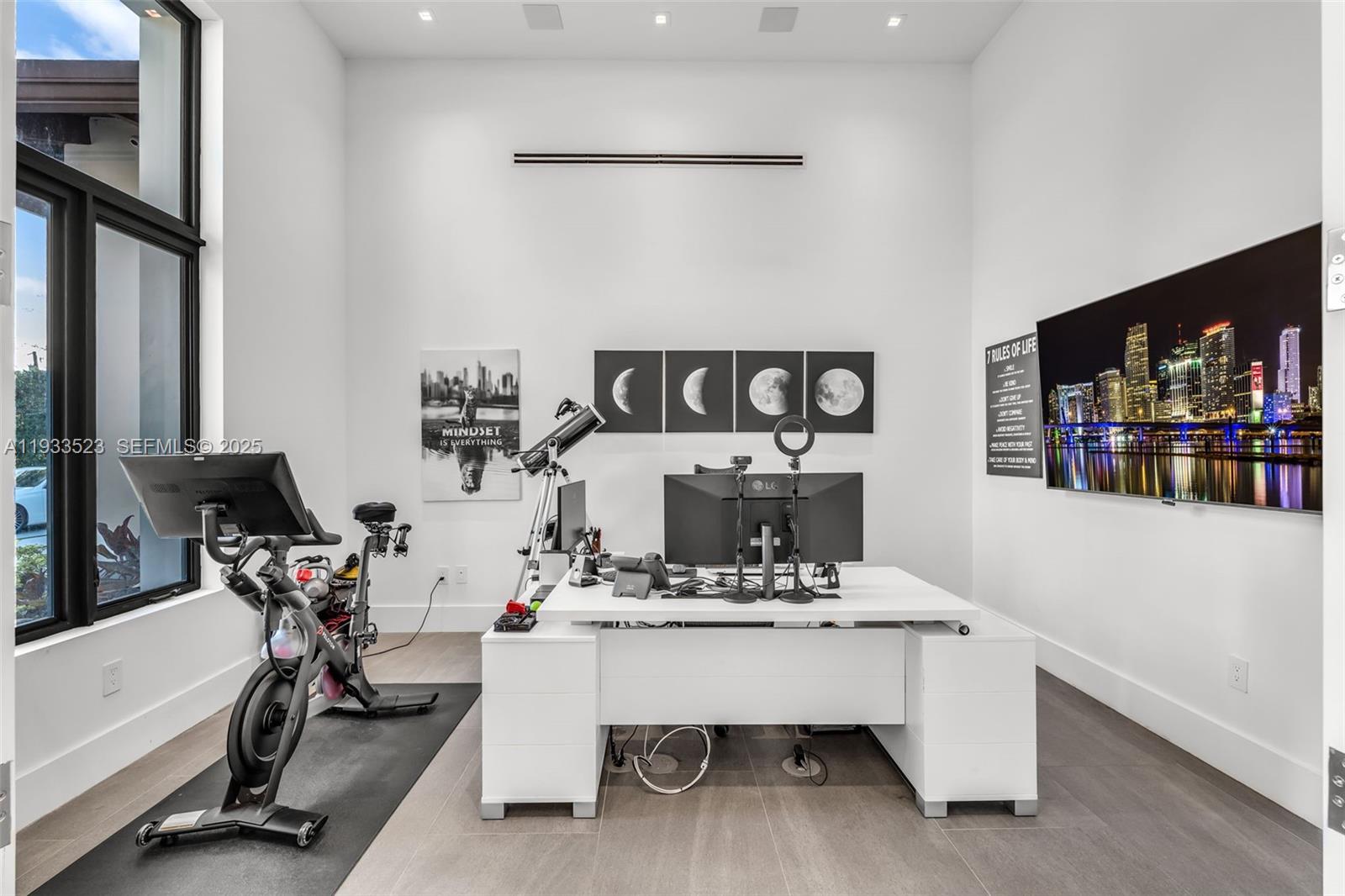 8271 Southwest 67th Street Miami, FL 33143 - Photo 45 of 88 a living room with furniture and a flat screen tv