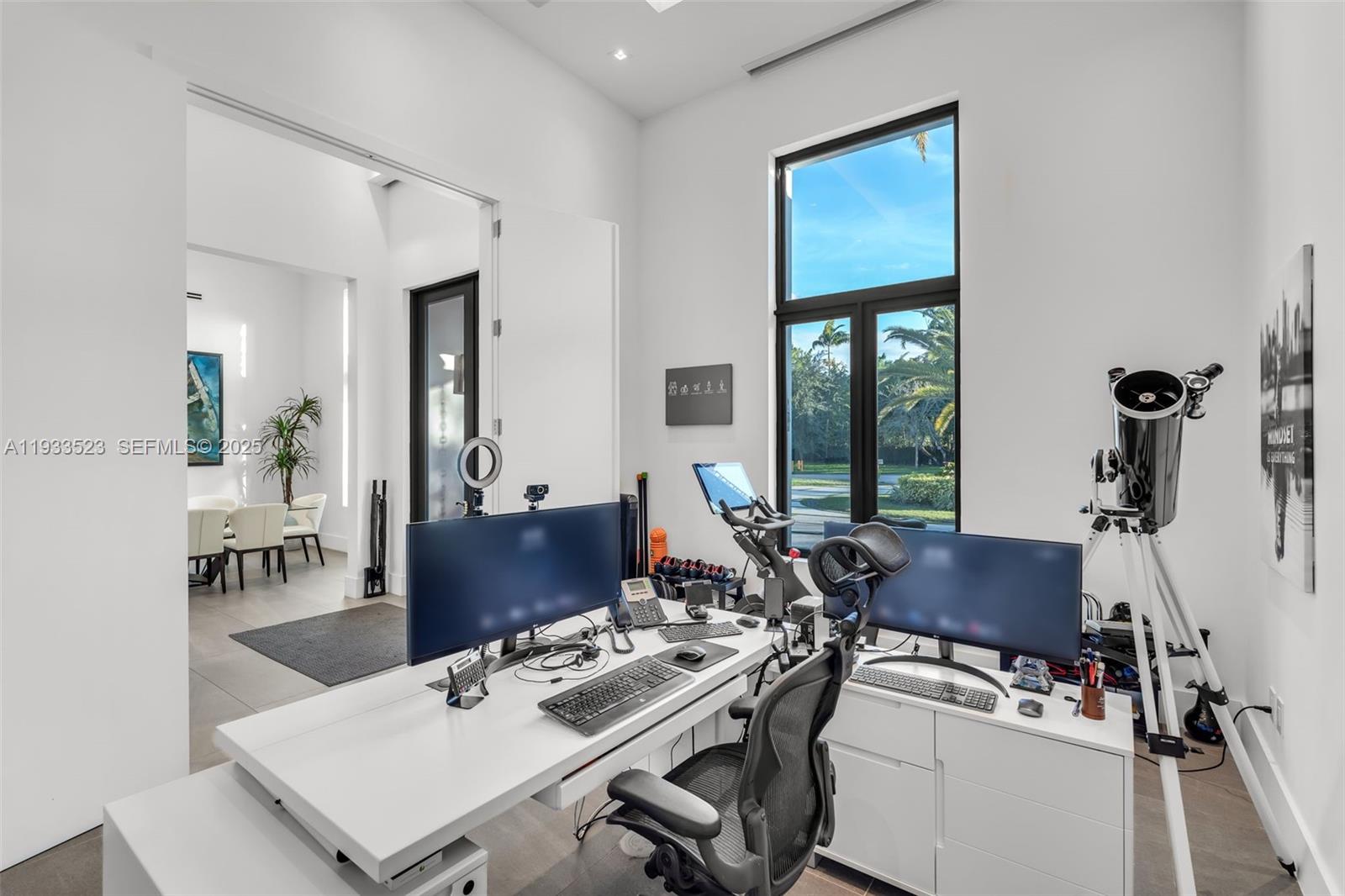 8271 Southwest 67th Street Miami, FL 33143 - Photo 46 of 88 a view of a workspace with furniture and window