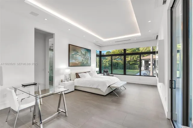 a bedroom with a bed and a couch