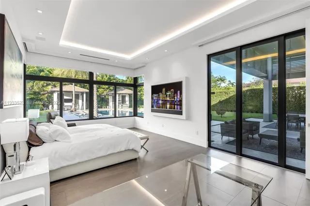 a bathroom with a double vanity sink toilet and shower