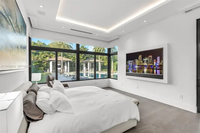 an aerial view of a house with a lake view