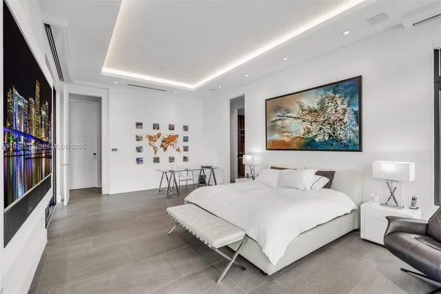 an aerial view of a house with a garden and lake view