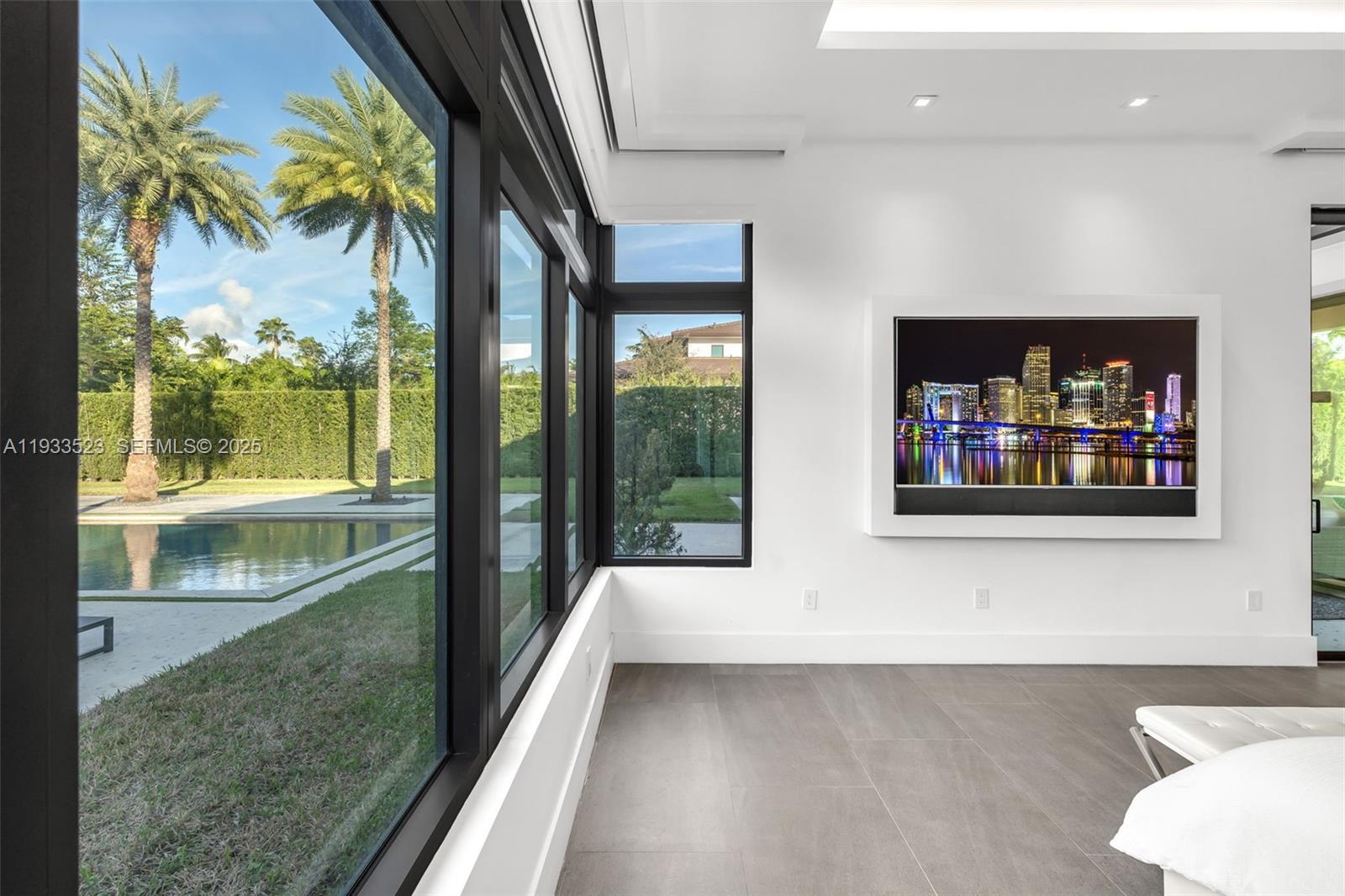 8271 Southwest 67th Street Miami, FL 33143 - Photo 51 of 88 a view of a living room and a floor to ceiling window or kitchen