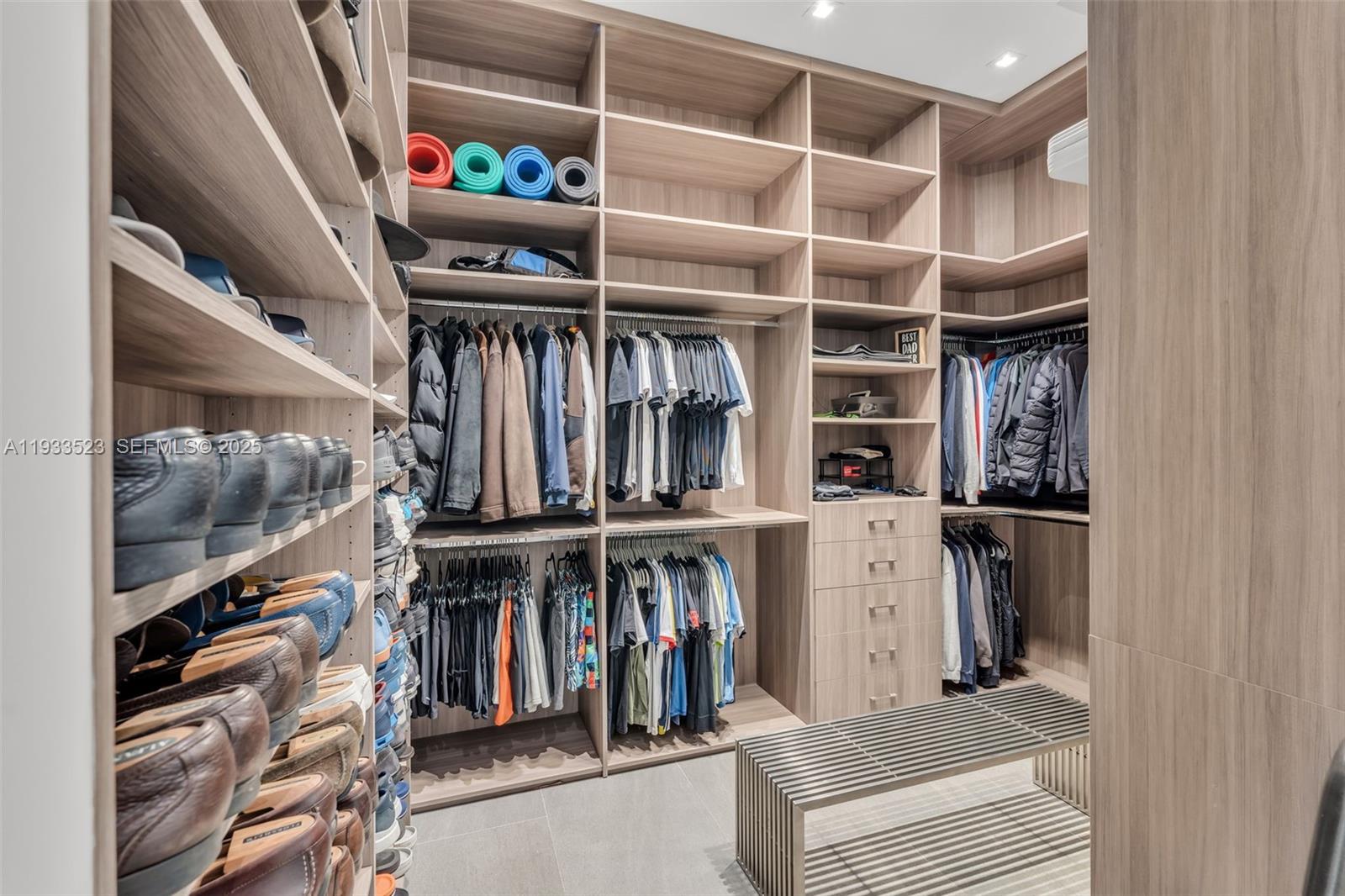 8271 Southwest 67th Street Miami, FL 33143 - Photo 53 of 88 a view of walk in closet with clothes and shoes