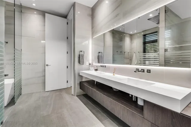 an aerial view of residential houses with outdoor space and swimming pool