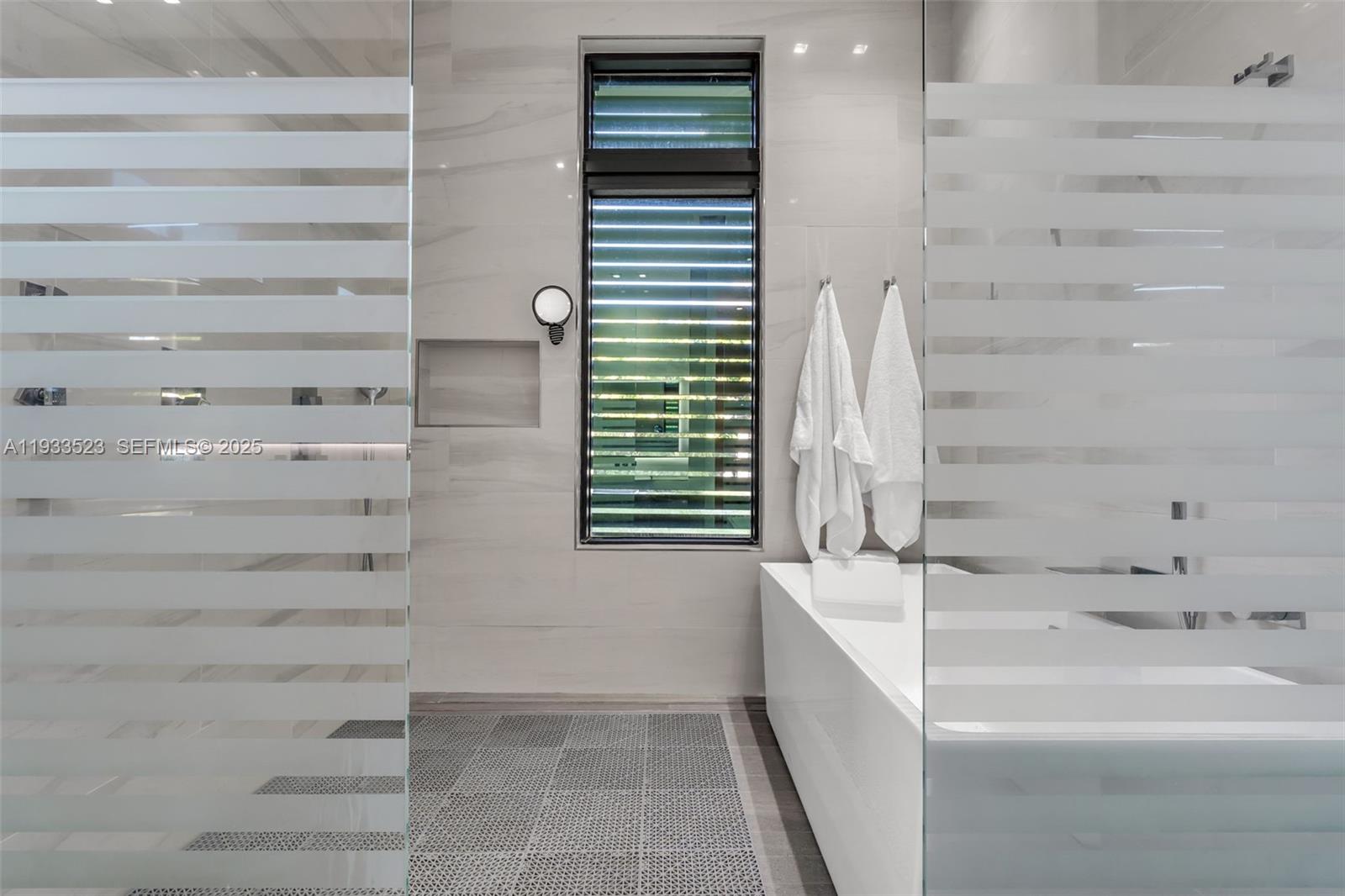 8271 Southwest 67th Street Miami, FL 33143 - Photo 58 of 88 a bathroom with a bathtub and a sink