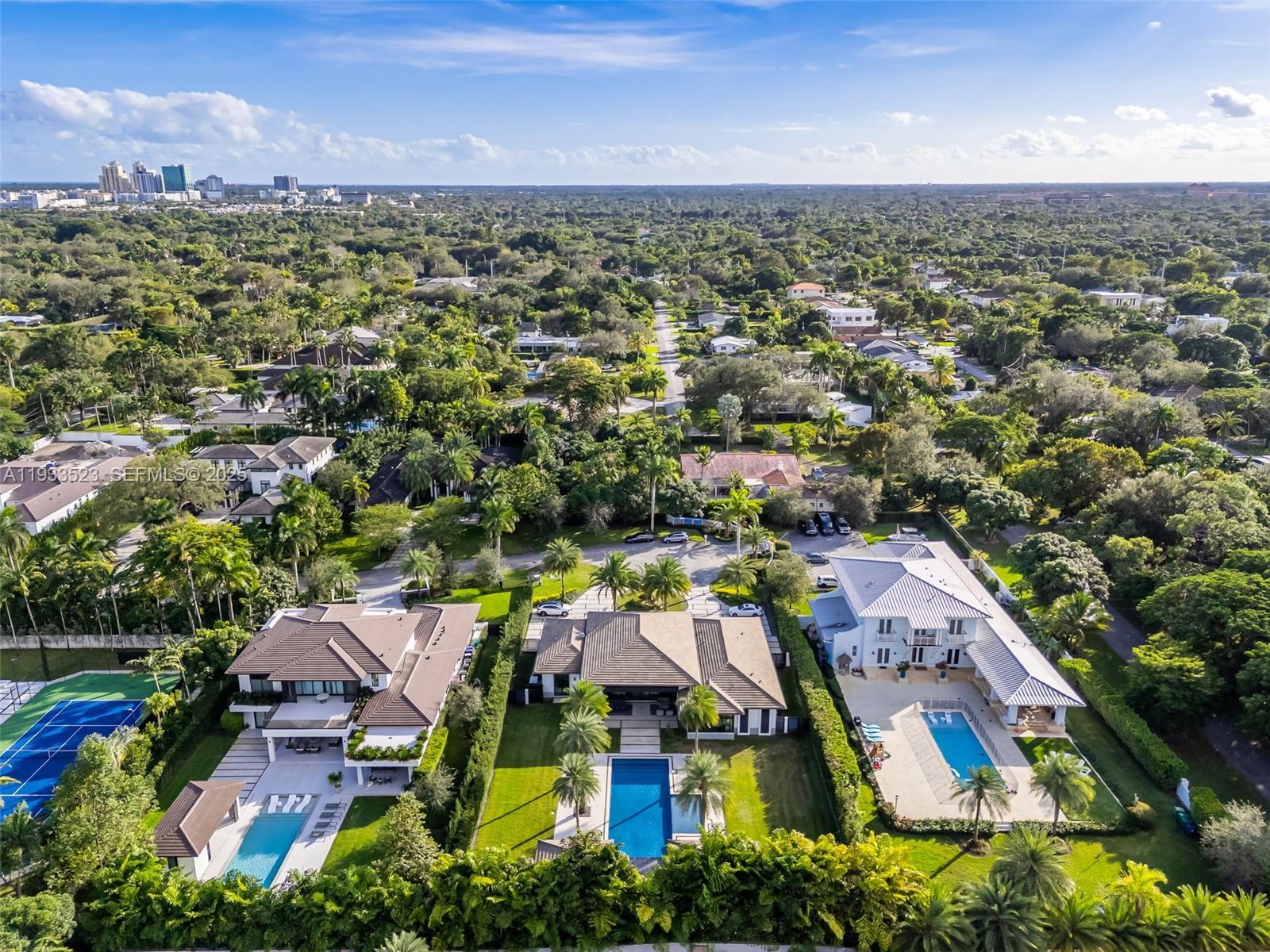8271 Southwest 67th Street Miami, FL 33143 - Photo 85 of 88 an aerial view of residential houses with outdoor space and trees