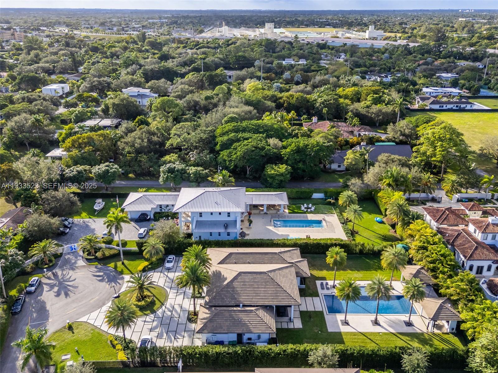 8271 Southwest 67th Street Miami, FL 33143 - Photo 87 of 88 an aerial view of a houses with a swimming pool