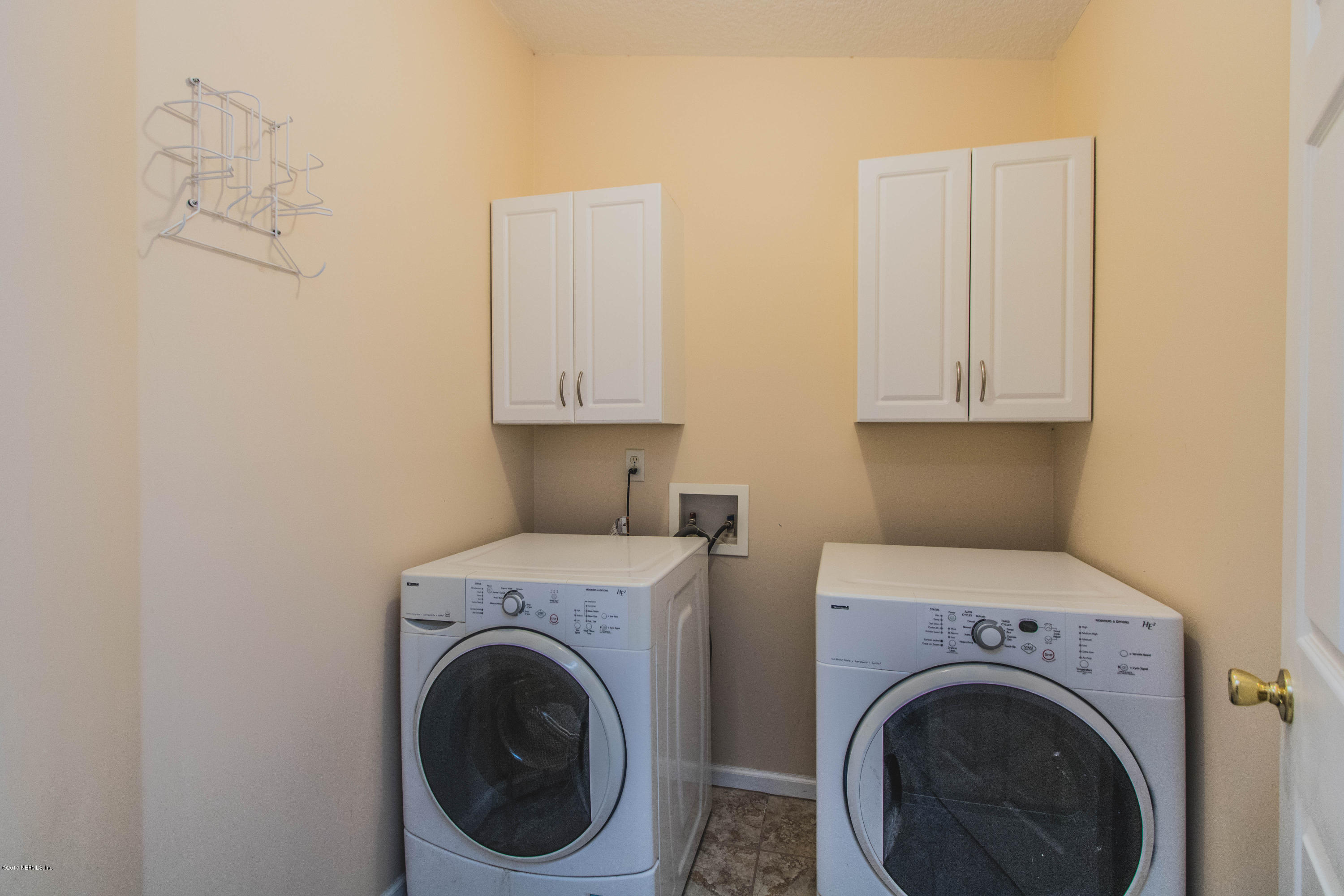 3123 Ravines Road Middleburg, FL 32068 - Photo 23 of 32 a utility room with dryer and washer