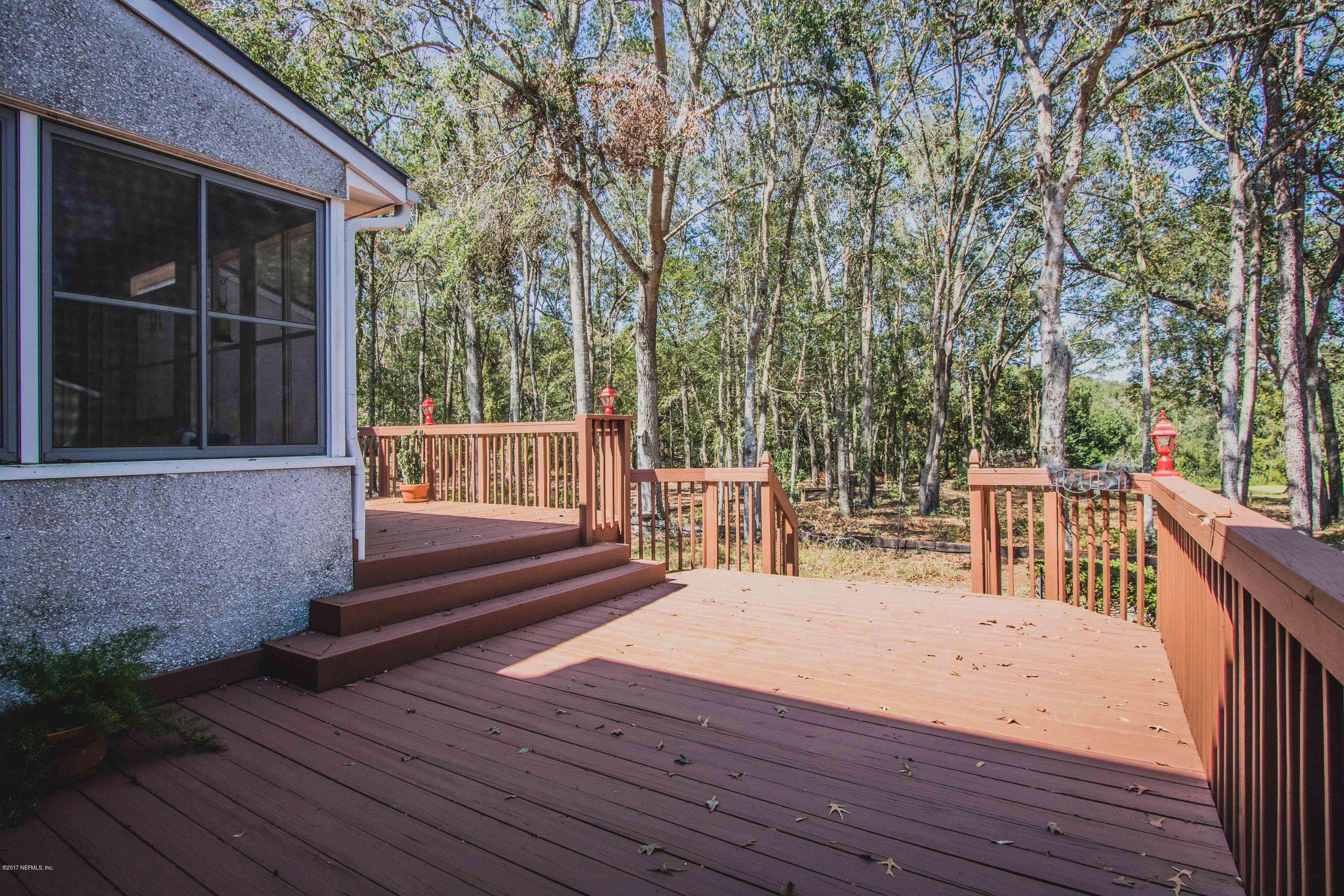 3123 Ravines Road Middleburg, FL 32068 - Photo 29 of 32 a balcony with wooden floor